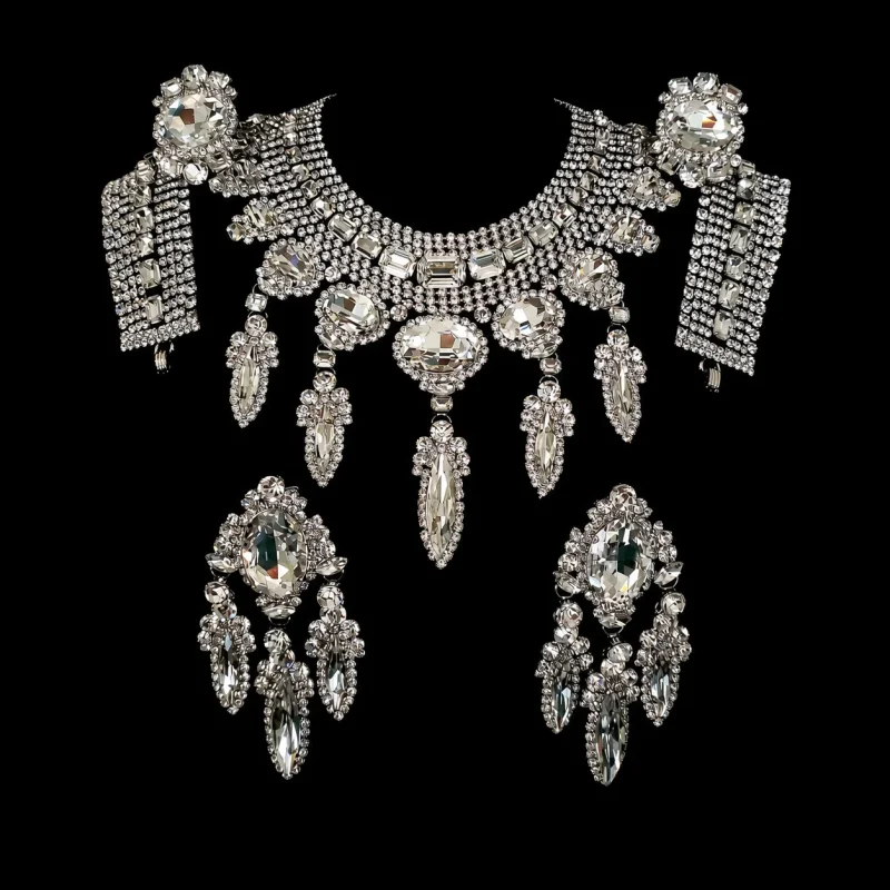 Dragon Lady’s Perfection crystal jewelry on a black studio background